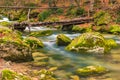 wooden bridge over a mountain river, beautiful