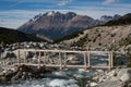 Wooden bridge over mountain stream. Royalty Free Stock Photo