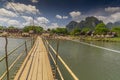 Wooden bridge over Nam Song river, Vang Vieng village, Laos Royalty Free Stock Photo