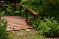 The Wooden Bridge over the pond with Flower Garden Royalty Free Stock Photo