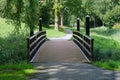 Wooden bridge over a pond Royalty Free Stock Photo