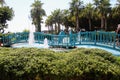 A wooden bridge over the pool with fountains in the park of the 100th anniversary of Ataturk Alanya, Turkey