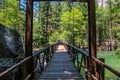 Wooden bridge over the raging King River in Kings Canyon National Park Royalty Free Stock Photo