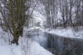 wooden bridge over the river in winter forest. Royalty Free Stock Photo