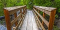 Wooden bridge over a rocky stream in Provo Canyon