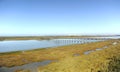 Wooden bridge over the San Pedro River in ToruÃ±os marsh. Bay of Cadiz Natural Park, Spain. Royalty Free Stock Photo