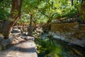 Wooden bridge over small Loutanis river in Seven spring Epta Piges in forest near Kolymbia Rhodes, Greece