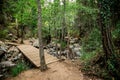 A wooden bridge over a small river on a way to Caledonia waterfall near Platres Royalty Free Stock Photo