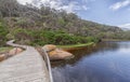 Wooden bridge over Tidal River and the river bank