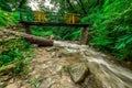 Wooden bridge over waterfall in himalayas - sainj, kullu, himachal, India