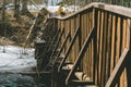 A wooden bridge over wild river. Royalty Free Stock Photo
