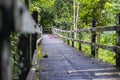 Wooden bridge in the rainforest of Borneo. Near the Orang Utan sanctuary Sepilok, Sabah, foot path in the jungle, crossing a small