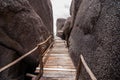 Wooden bridge with rock