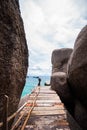 Wooden bridge with rock