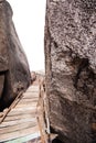 Wooden bridge with rock