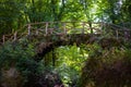 Wooden bridge of SchiessentÃÂ¼mpel or SchÃÂ©issendÃÂ«mpel Waterfall in Mullerthal, Luxembourg