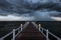 Wooden bridge into the sea Royalty Free Stock Photo