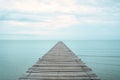 A wooden bridge that stretches out to the sea Royalty Free Stock Photo