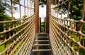 Wooden bridge with strong robe at playground perspective Royalty Free Stock Photo