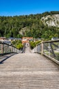 Wooden bridge Tatzelwurm in Essing at Altmuehl river below the ruins of Randeck Castle, Bavaria, Germany