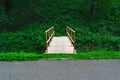 Wooden bridge in tropical rain forest. Walkway Royalty Free Stock Photo