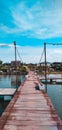 a wooden bridge used as a walkway across a drain