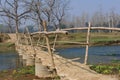 Wooden bridge in village in Nepal A bridge across the River Rapti, in the Chitwan National Park. Nepal Royalty Free Stock Photo