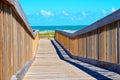 Wooden bridge walk to the ocean beach Royalty Free Stock Photo