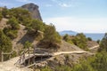 Wooden bridge on a walking trail in the mountains. Black sea coast. Royalty Free Stock Photo