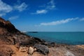 Wooden bridge walkway along the rocks coast and sea with blue sky summer time Royalty Free Stock Photo