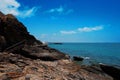 Wooden bridge walkway along the rocks coast and sea with blue sky summer time Royalty Free Stock Photo