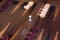 Wooden brown backgammon game with a dice