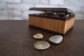 Wooden brown box for storing the sacred objects of the fortuneteller, flat stones for fortune-telling for the future, the concept