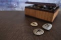 Wooden brown box for storing the sacred objects of the fortuneteller, flat stones with runes for fortune telling for the future,