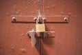 Wooden brown door background locked with two padlocks. Aged entrance, close up view with details. Royalty Free Stock Photo