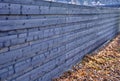 Wooden brown opaque fence with horizontally attached planks. fence as protection against noise from cars driving on the street. au Royalty Free Stock Photo