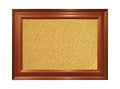 Wooden and brown ornamental frame with rectangular beige cork board Royalty Free Stock Photo