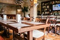 Wooden brown tables with wooden chair in the cozy restraunt Royalty Free Stock Photo