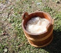 wooden bucket for coloring wool with the ancient medieval method Royalty Free Stock Photo