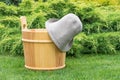 Wooden bucket and felt hat for the sauna.