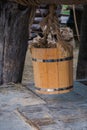 Wooden bucket hanging over groundwater well