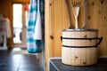 wooden bucket and ladle next to a sauna stove Royalty Free Stock Photo