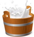 Wooden bucket with milk splash isolated on white - vector