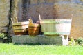 Wooden buckets and tubs in the courtyard of fortresses Guaita on