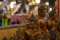 Wooden Buddha figures on souvenir market in Siem Reap, Cambodia. Traditional arts and crafts of Asia.