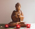 Wooden buddha in meditation