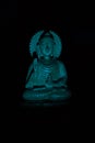 WOODEN BUDDHA STATUE IN LUMINANCE LIGHTING