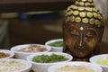 Wooden buddha statue and food spices