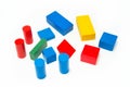 Wooden building blocks shaped like a cube, cylinder, prism and triangle of red, green, blue, green and yellow color. Isolated on Royalty Free Stock Photo