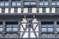 Wooden building facade with hunting trophy sculpture